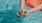 woman relaxes on a floatie in swimming pool